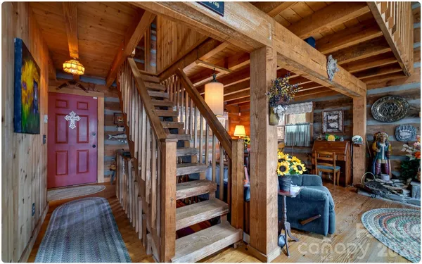 a view of living room kitchen and entryway