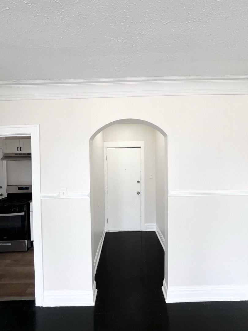 4134 West 24th Place, Unit E2 Chicago, IL 60623 - Photo 8 of 9 a view of a closet area with rug