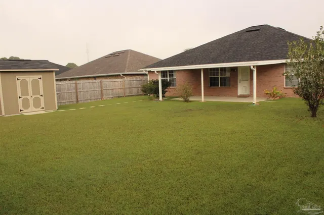 a view of a house with a garden