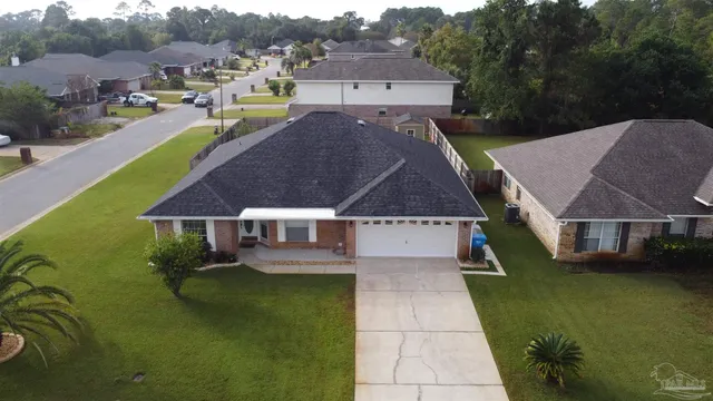 an aerial view of a house with a garden