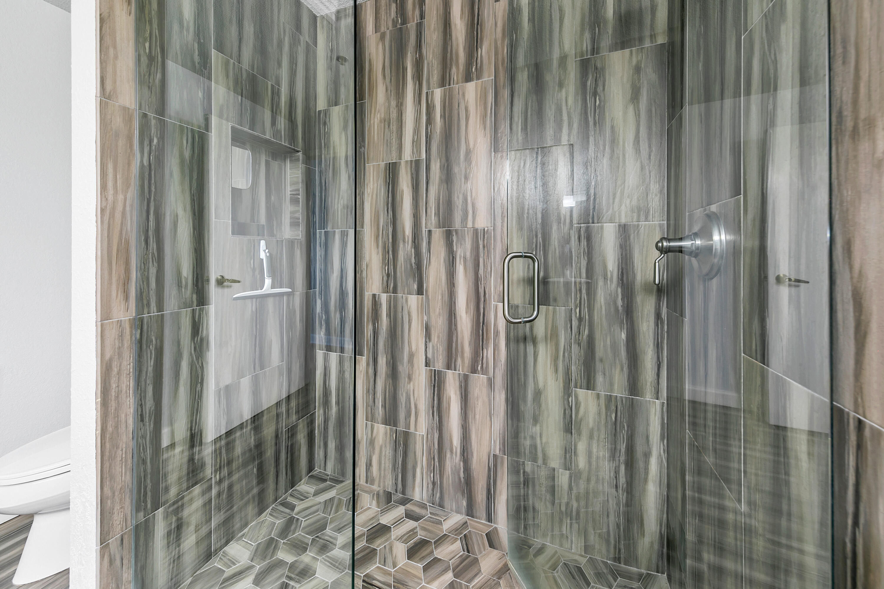 515 Tops'l Beach Boulevard, Unit 913 Miramar Beach, FL 32550 - Photo 15 of 34 a bathroom with a glass door shower