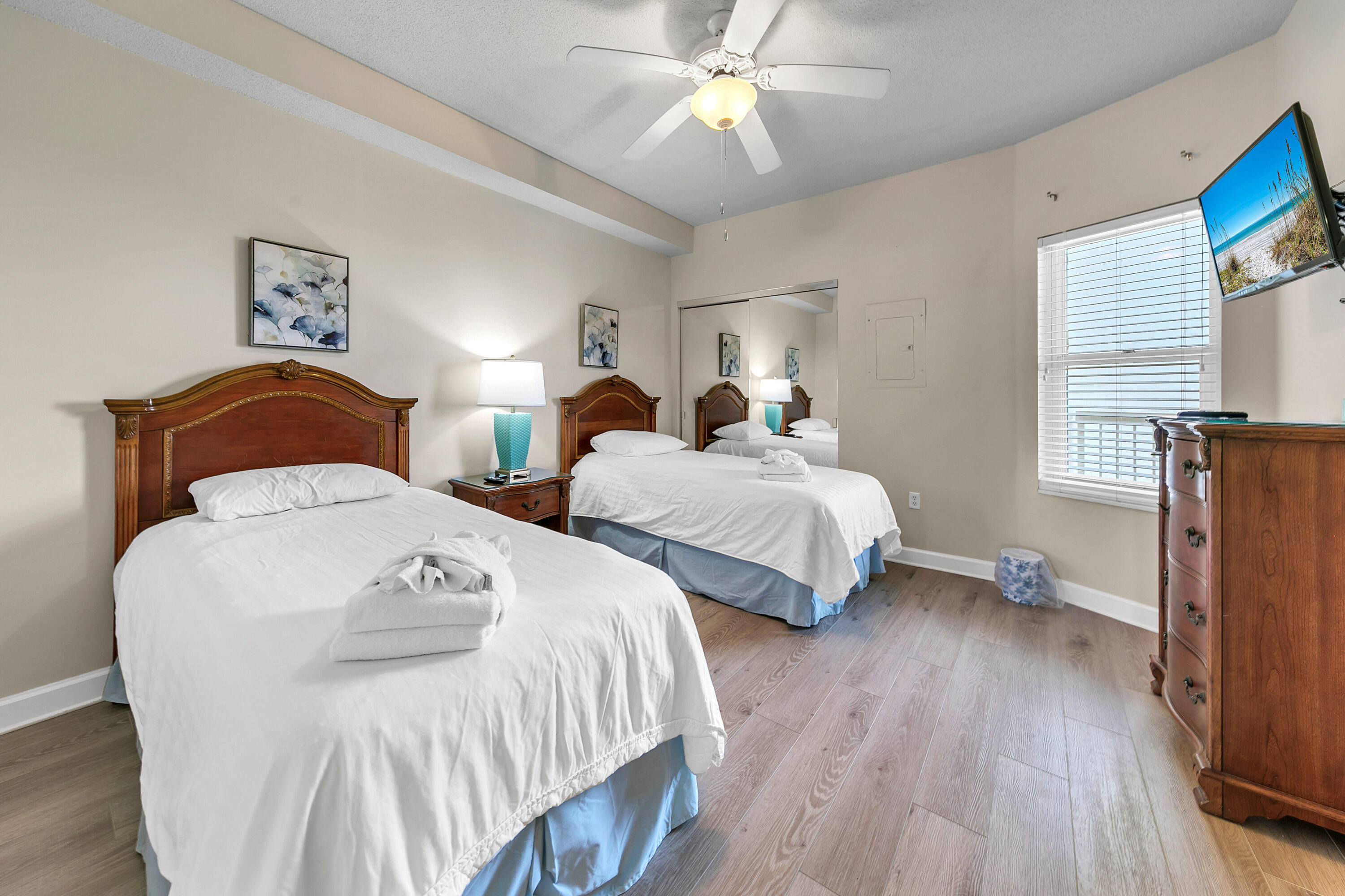 515 Tops'l Beach Boulevard, Unit 913 Miramar Beach, FL 32550 - Photo 16 of 34 a bedroom with two beds and a chandelier