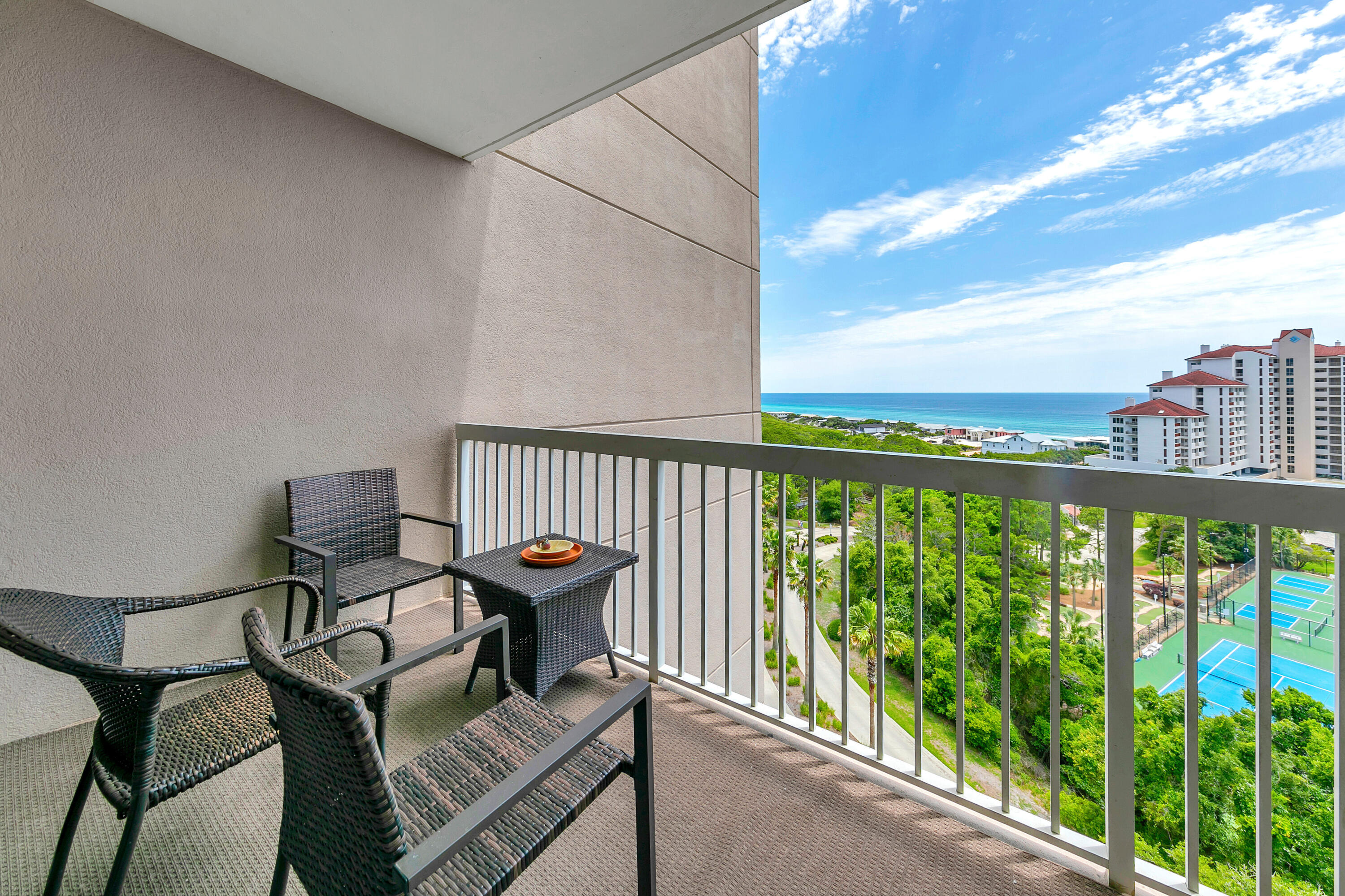 515 Tops'l Beach Boulevard, Unit 913 Miramar Beach, FL 32550 - Photo 20 of 34 a view of a balcony with chair and wooden floor