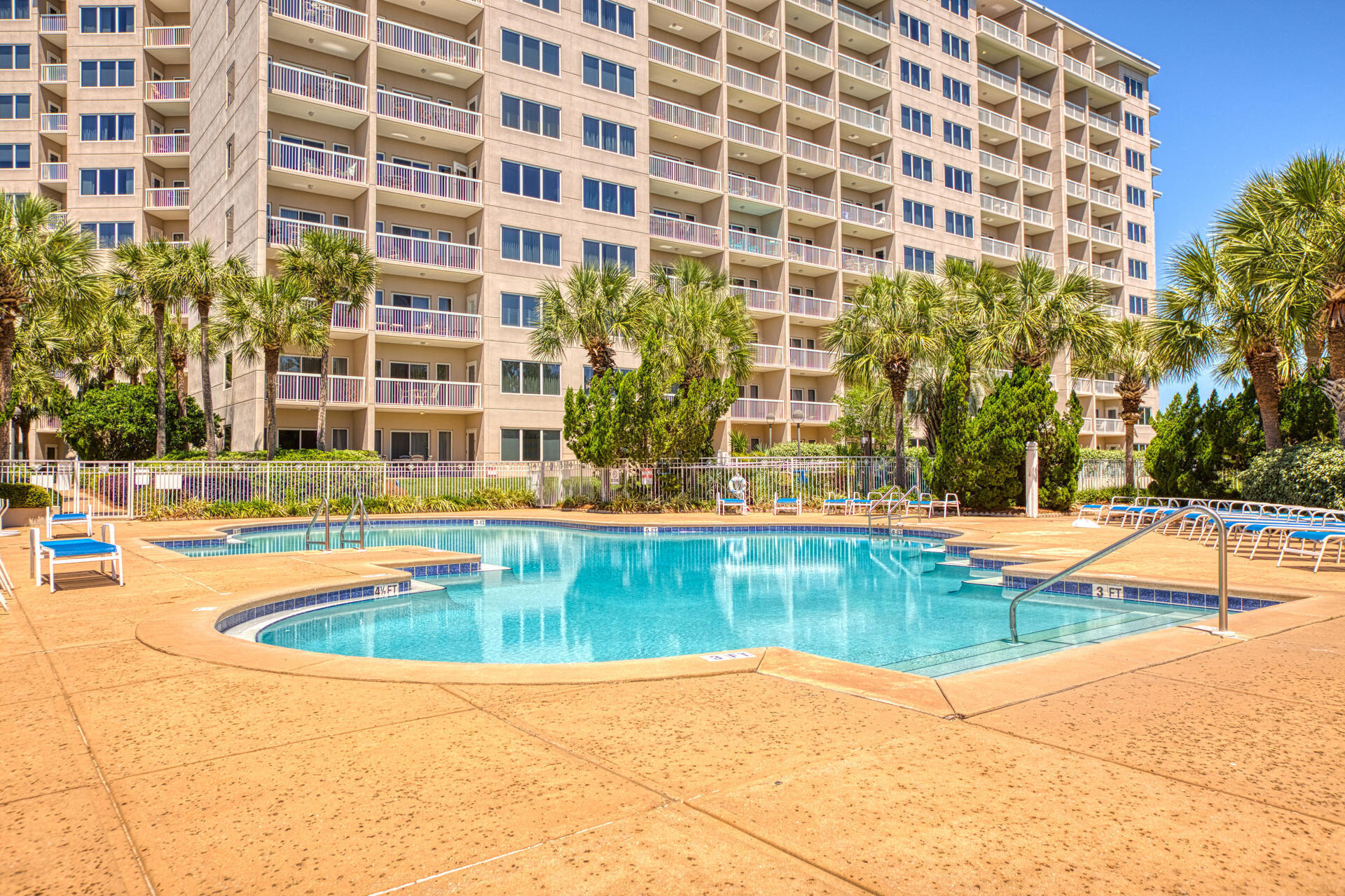 515 Tops'l Beach Boulevard, Unit 913 Miramar Beach, FL 32550 - Photo 30 of 34 a view of a swimming pool with a lounge chair