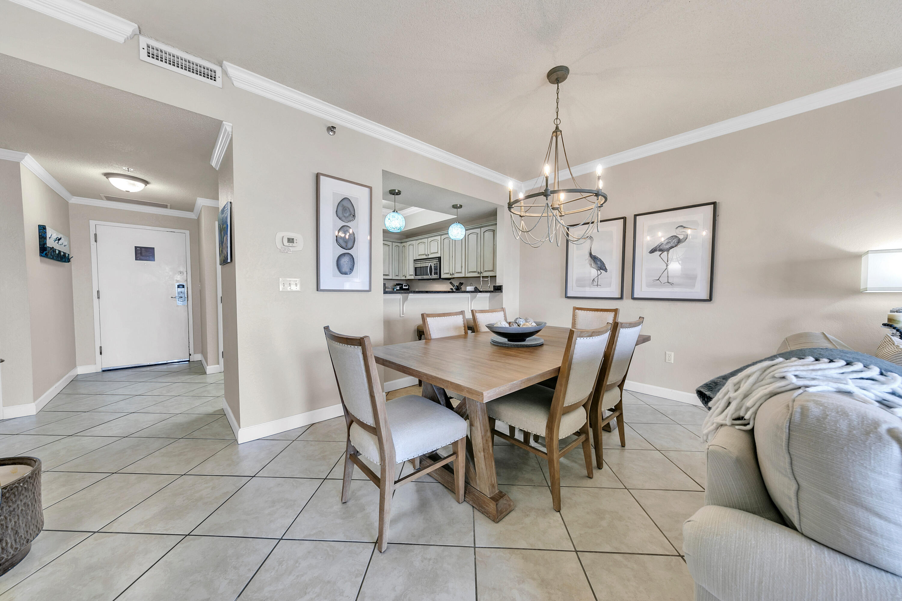 515 Tops'l Beach Boulevard, Unit 913 Miramar Beach, FL 32550 - Photo 3 of 34 a view of a dining room with furniture and chandelier