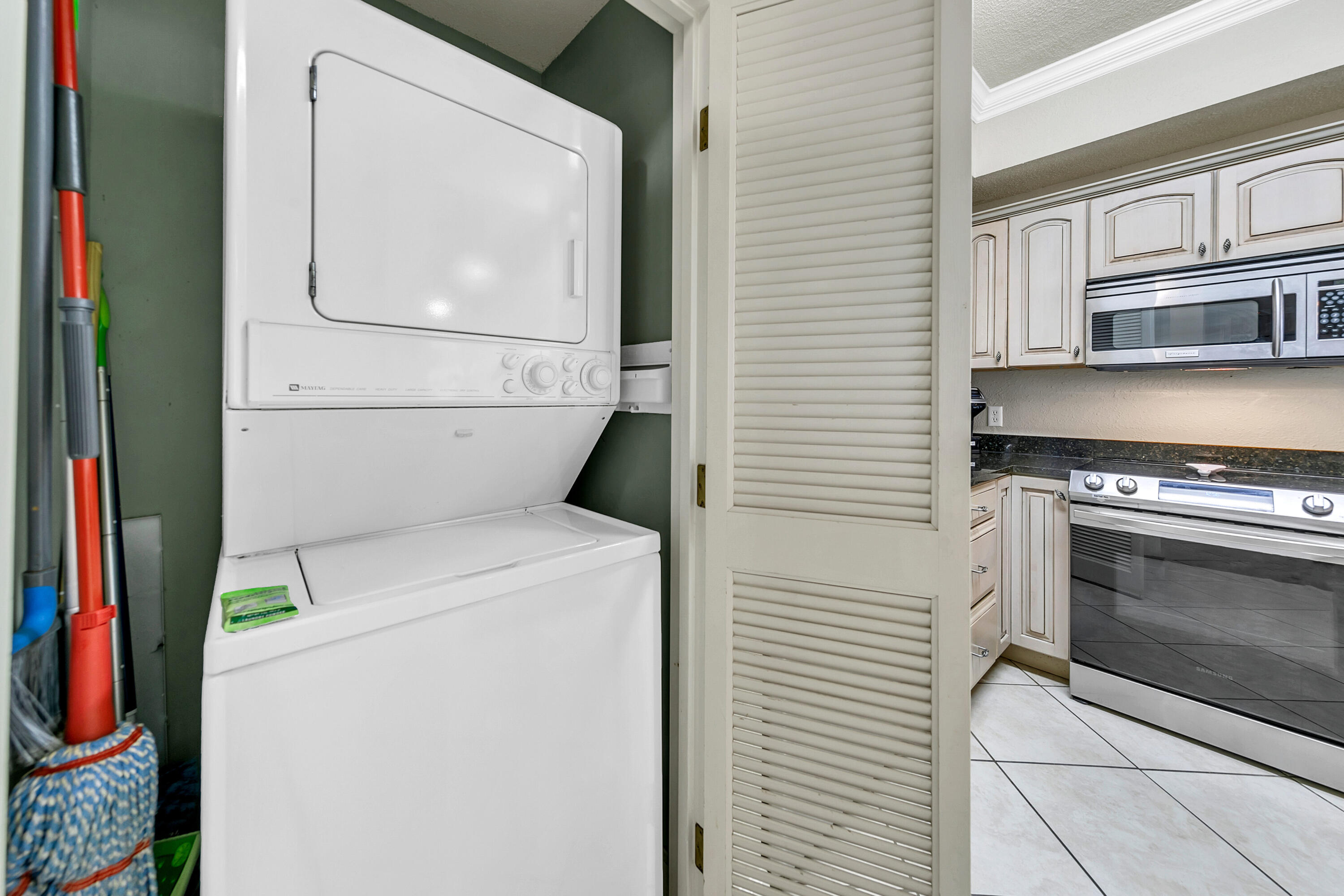 515 Tops'l Beach Boulevard, Unit 913 Miramar Beach, FL 32550 - Photo 32 of 34 a utility room with dryer and washer