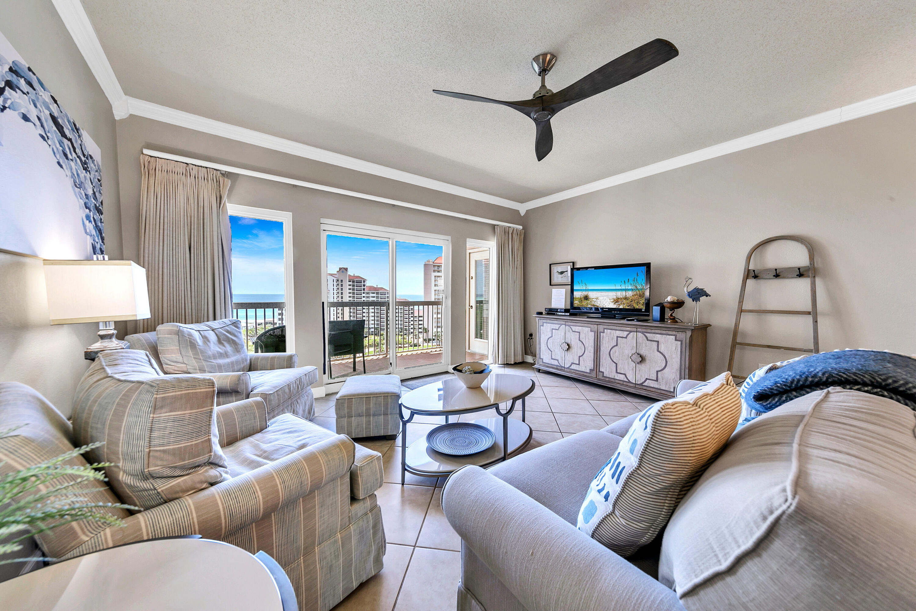 515 Tops'l Beach Boulevard, Unit 913 Miramar Beach, FL 32550 - Photo 5 of 34 a living room with furniture a ceiling fan and a rug
