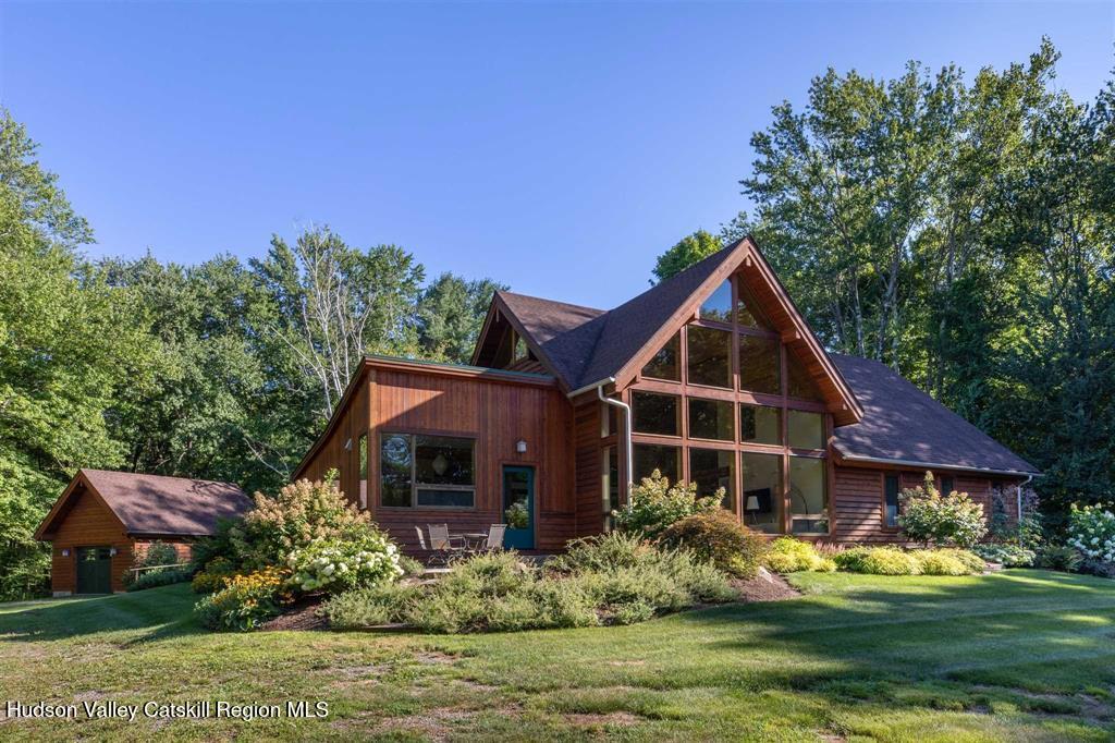 195 Vlei Road Rhinebeck, NY 12572 - Photo 1 of 24 a front view of a house with garden