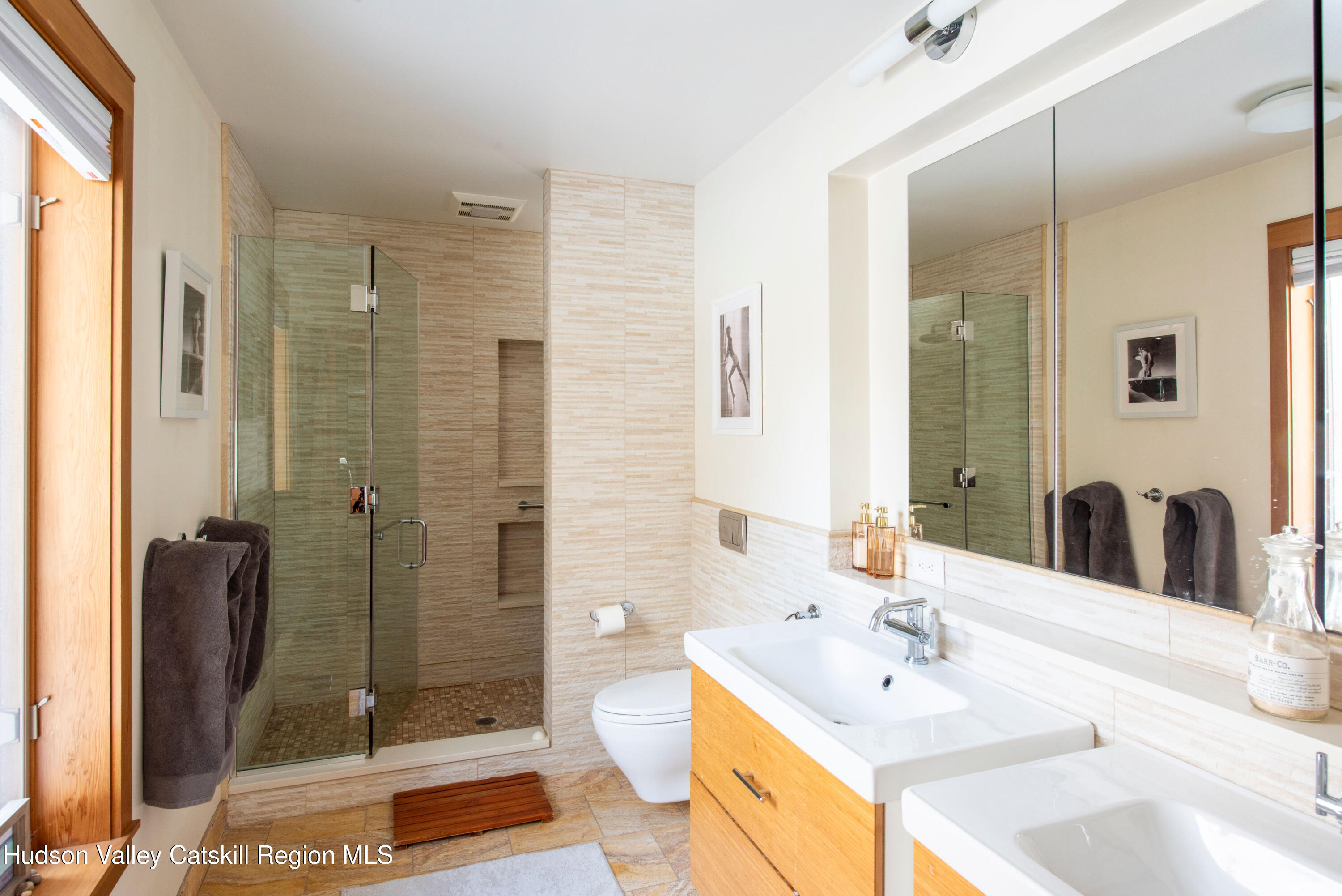 195 Vlei Road Rhinebeck, NY 12572 - Photo 12 of 24 a bathroom with a double vanity sink mirror and shower