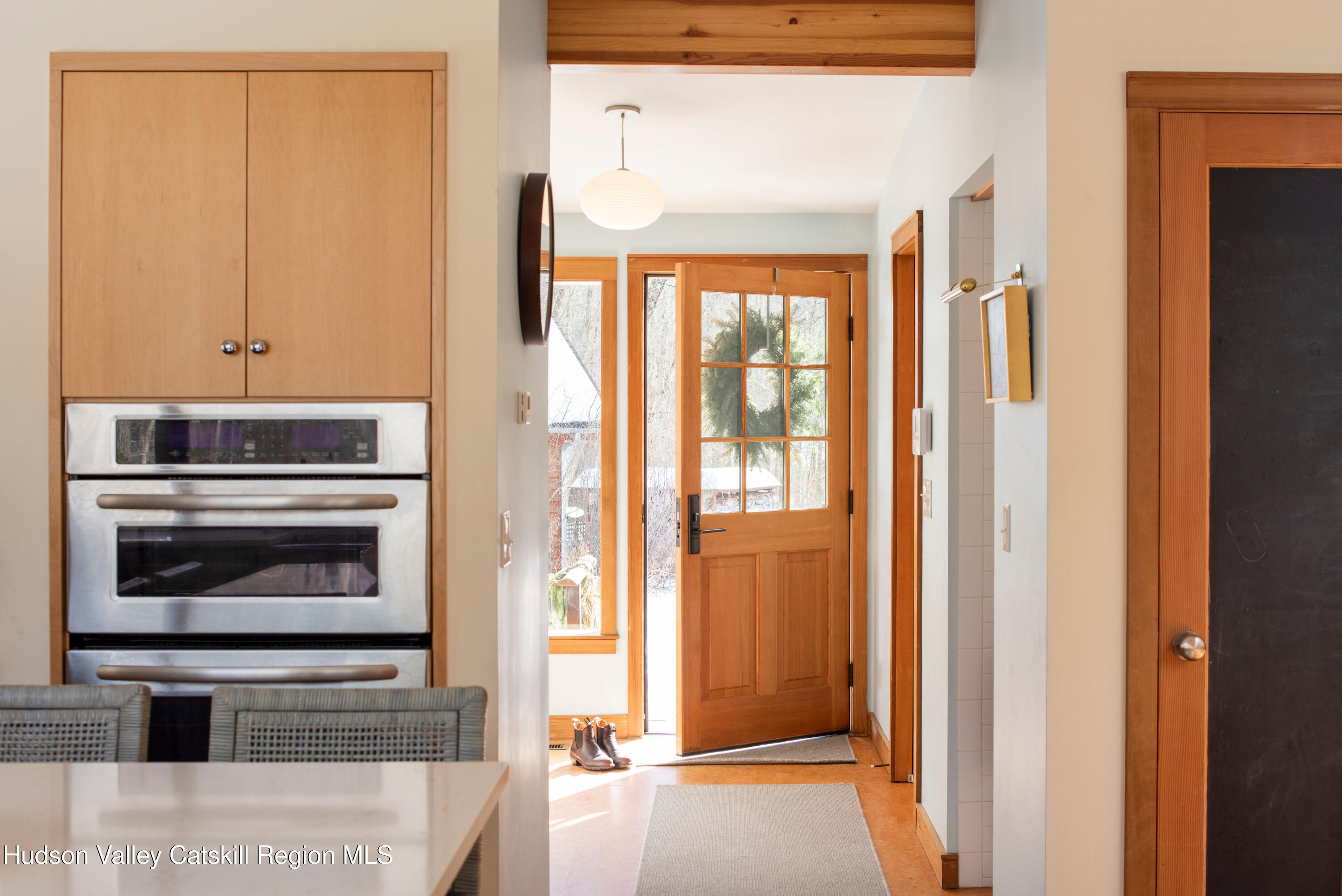 195 Vlei Road Rhinebeck, NY 12572 - Photo 2 of 24 a kitchen with a refrigerator and window