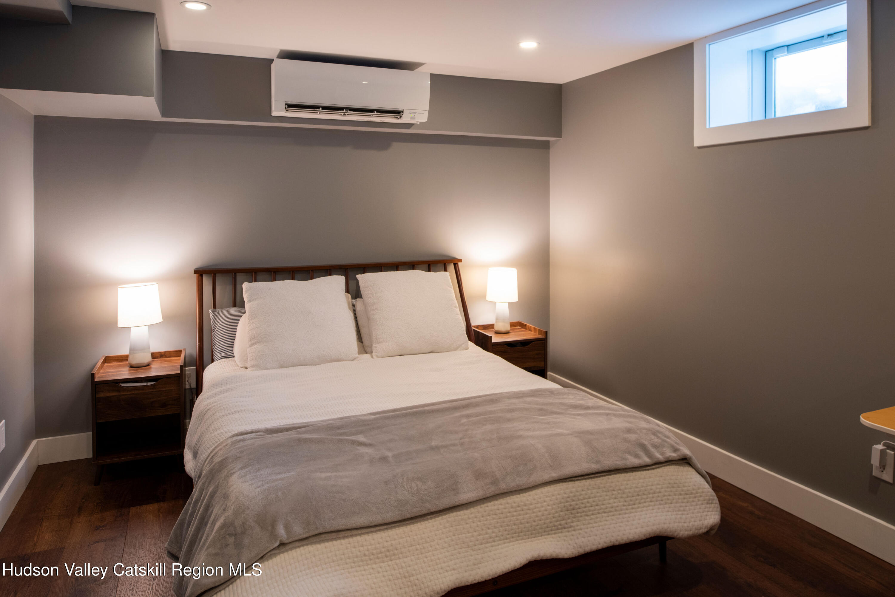 195 Vlei Road Rhinebeck, NY 12572 - Photo 21 of 24 a bedroom with a bed and lamps
