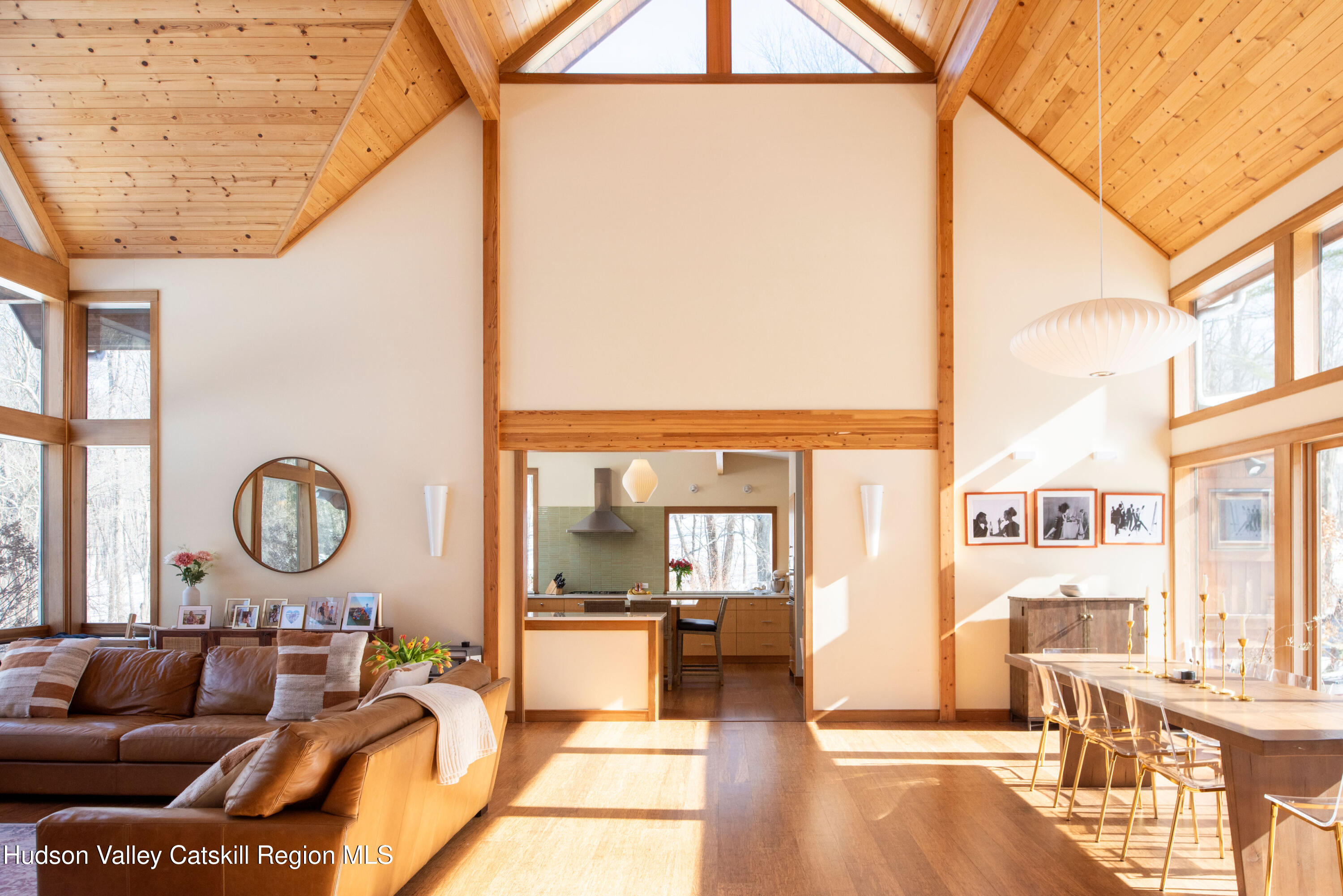 195 Vlei Road Rhinebeck, NY 12572 - Photo 5 of 24 a living room with furniture and a large window