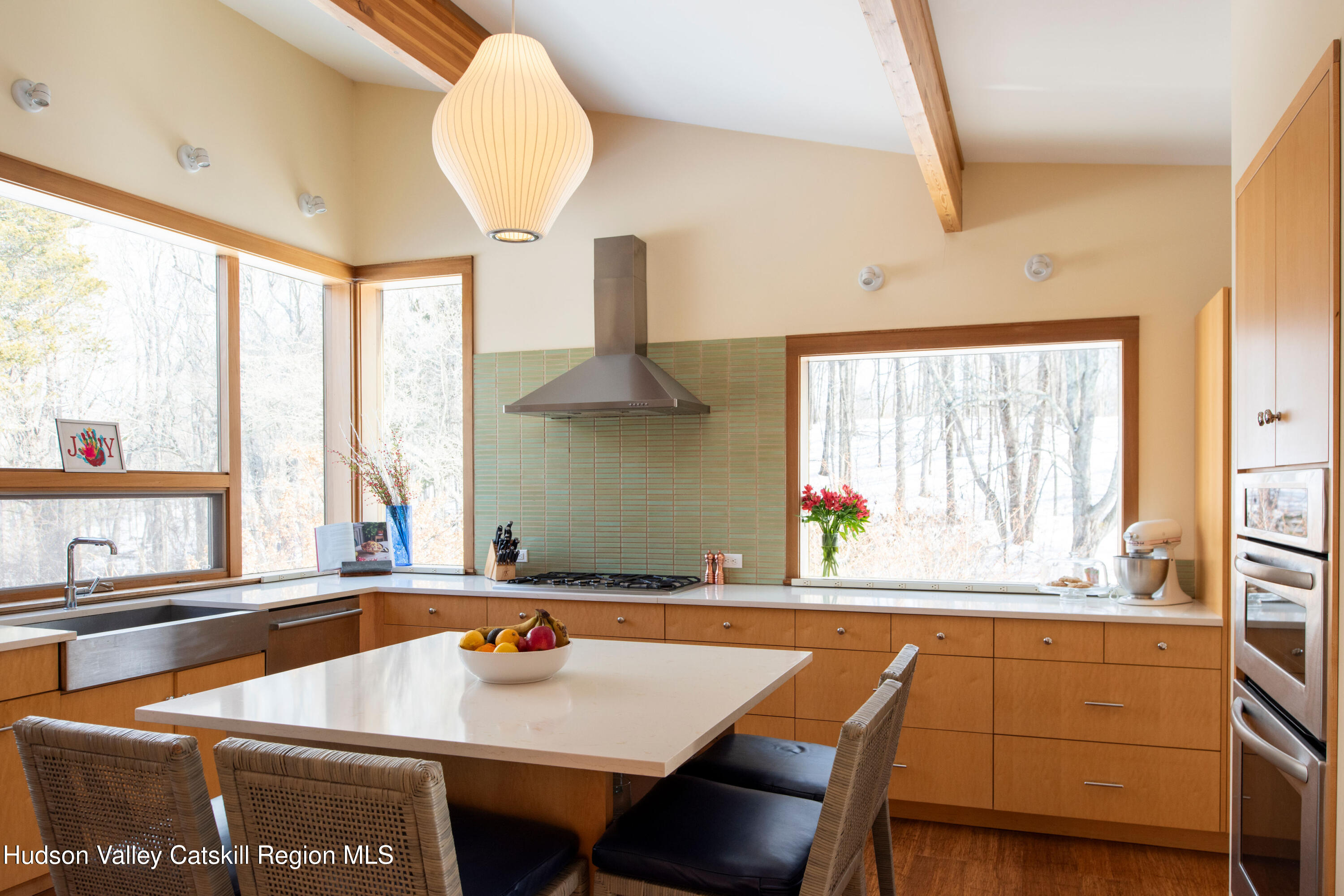 195 Vlei Road Rhinebeck, NY 12572 - Photo 7 of 24 a kitchen with a table chairs and a sink