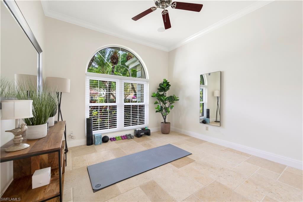 217 Silverado Drive Naples, FL 34119 - Photo 12 of 18 a living room with a large window