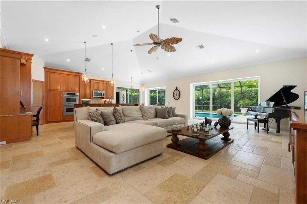 217 Silverado Drive Naples, FL 34119 - Photo 13 of 18 a living room with furniture ceiling fan and a window