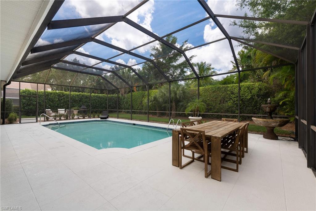 217 Silverado Drive Naples, FL 34119 - Photo 16 of 18 a outdoor view with a sitting space