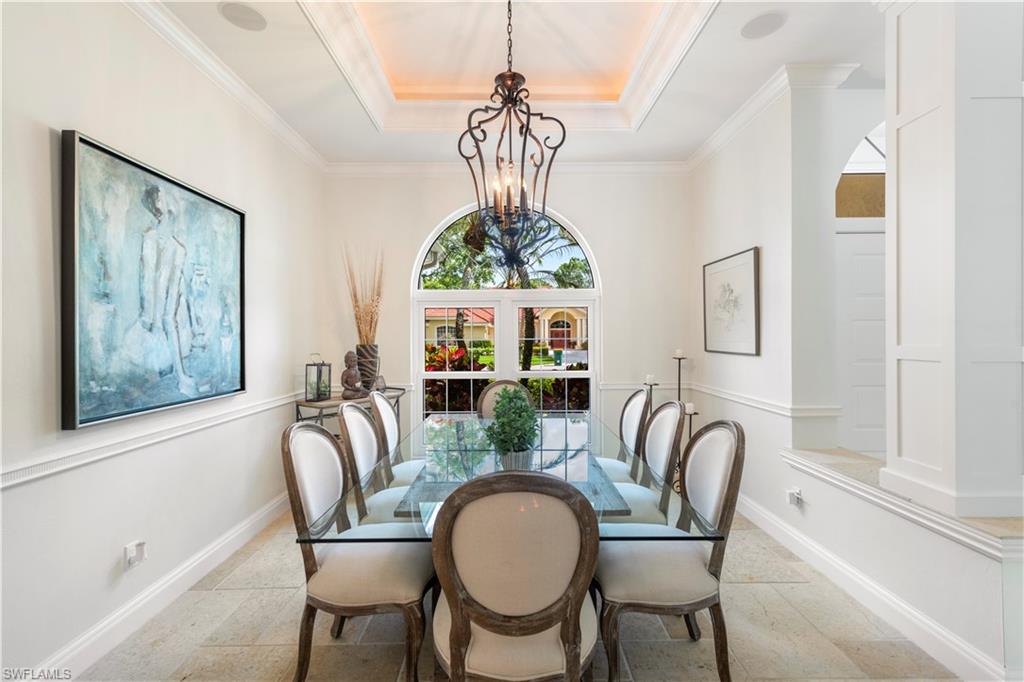 217 Silverado Drive Naples, FL 34119 - Photo 3 of 18 a view of a dining room with furniture window and outside view