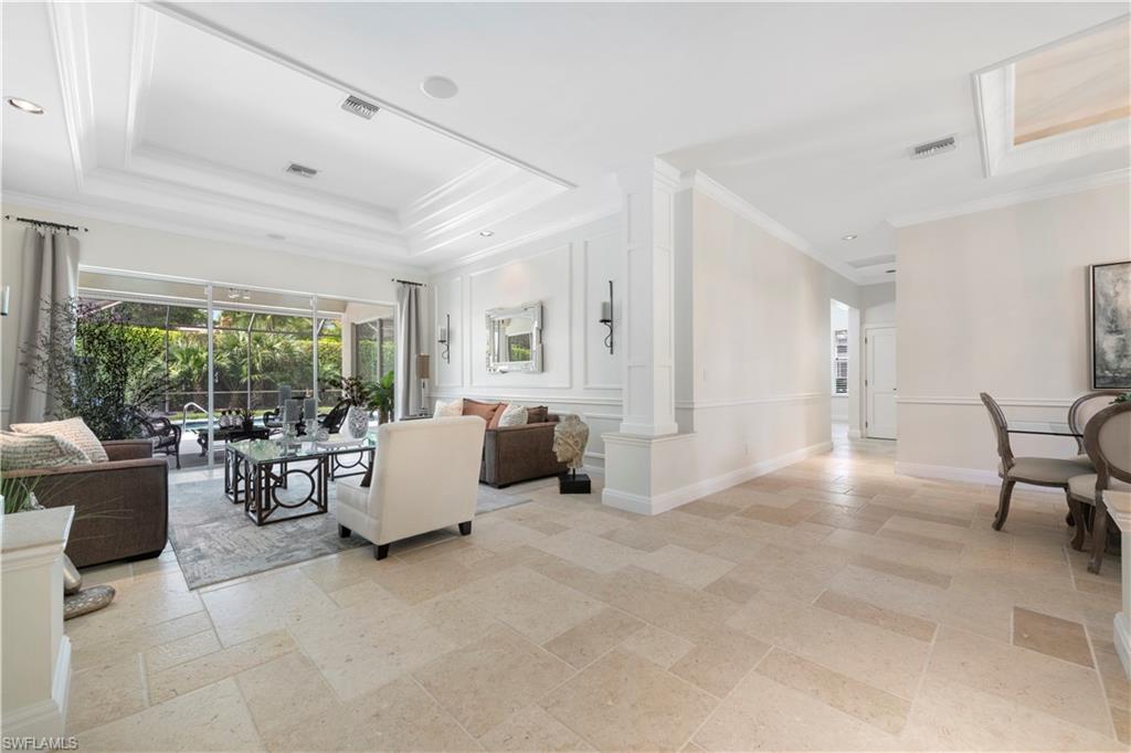 217 Silverado Drive Naples, FL 34119 - Photo 4 of 18 a living room with furniture and a large window