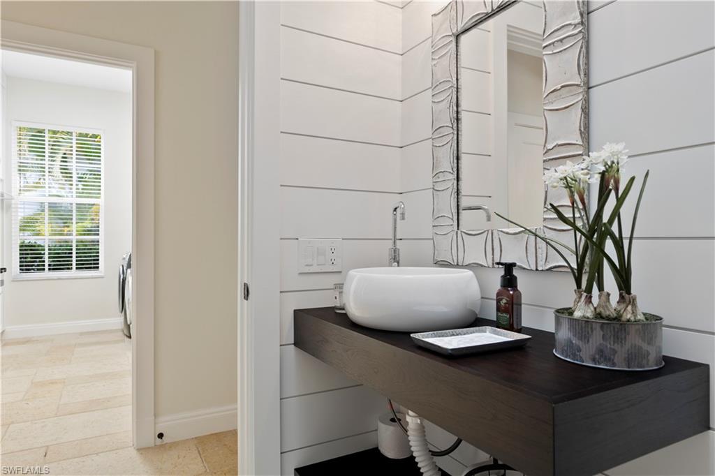 217 Silverado Drive Naples, FL 34119 - Photo 5 of 18 a vase of flowers sitting on a table