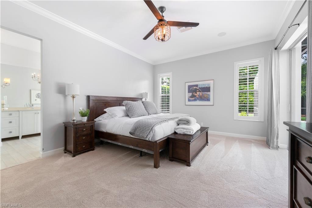 217 Silverado Drive Naples, FL 34119 - Photo 6 of 18 a bedroom with a bed and a window