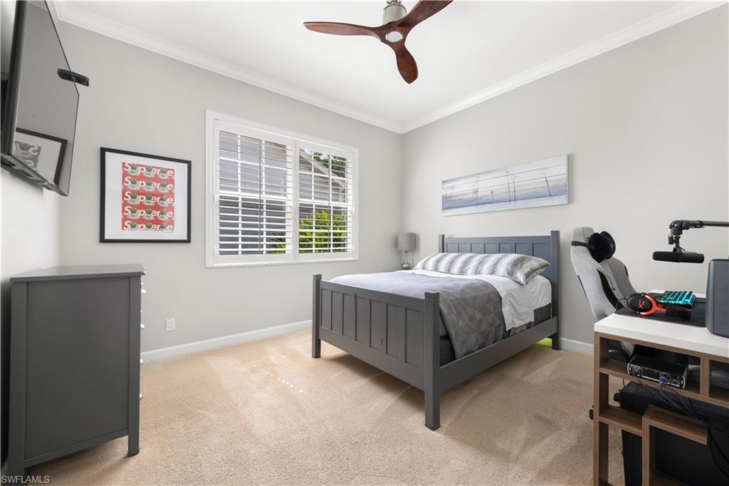 217 Silverado Drive Naples, FL 34119 - Photo 10 of 18 a bedroom with a bed and a window