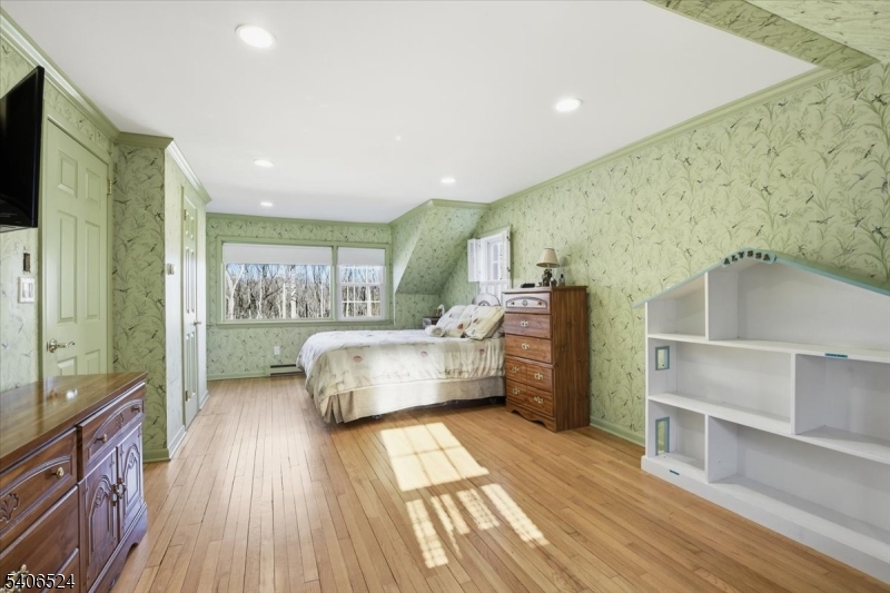 309 North Road Chester, NJ 07930 - Photo 18 of 37 a bedroom with furniture and a wooden floor