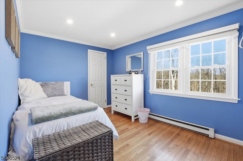 309 North Road Chester, NJ 07930 - Photo 20 of 37 a bedroom with a bed and wooden floor