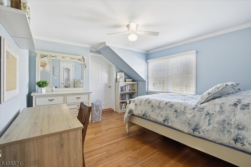 309 North Road Chester, NJ 07930 - Photo 21 of 37 a living room with a bed furniture and paintings on the wall