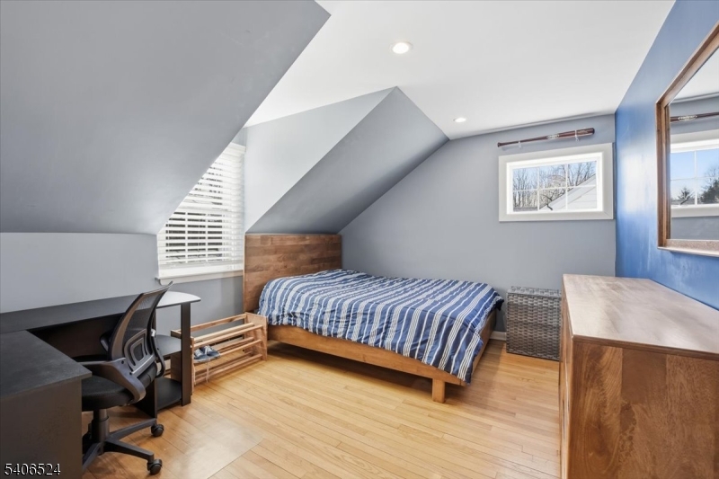 309 North Road Chester, NJ 07930 - Photo 22 of 37 a room with a bed and a desk