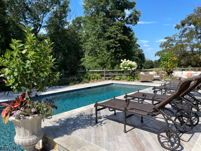 309 North Road Chester, NJ 07930 - Photo 4 of 37 a view of a lake with a table and chairs