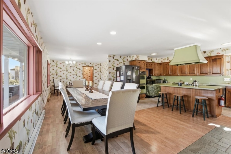 309 North Road Chester, NJ 07930 - Photo 9 of 37 a view of a dining room with furniture and a floor to ceiling window
