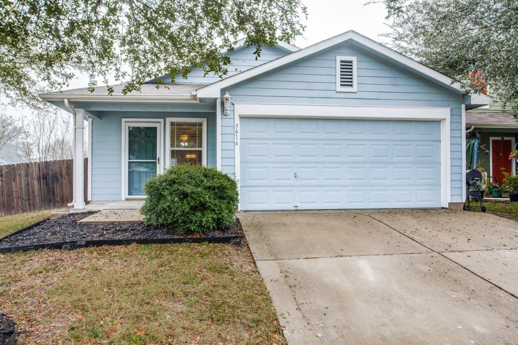 Undisclosed Address Austin, TX 78744 - Photo 1 of 18 a front view of a house with garden