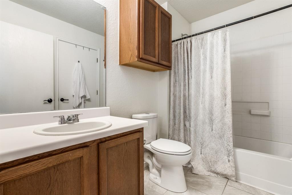 Undisclosed Address Austin, TX 78744 - Photo 12 of 18 a bathroom with a sink a toilet and shower