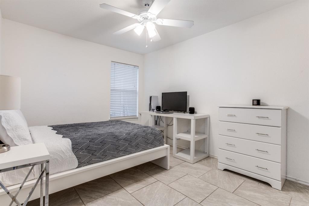 Undisclosed Address Austin, TX 78744 - Photo 8 of 18 a bedroom with a bed and a television