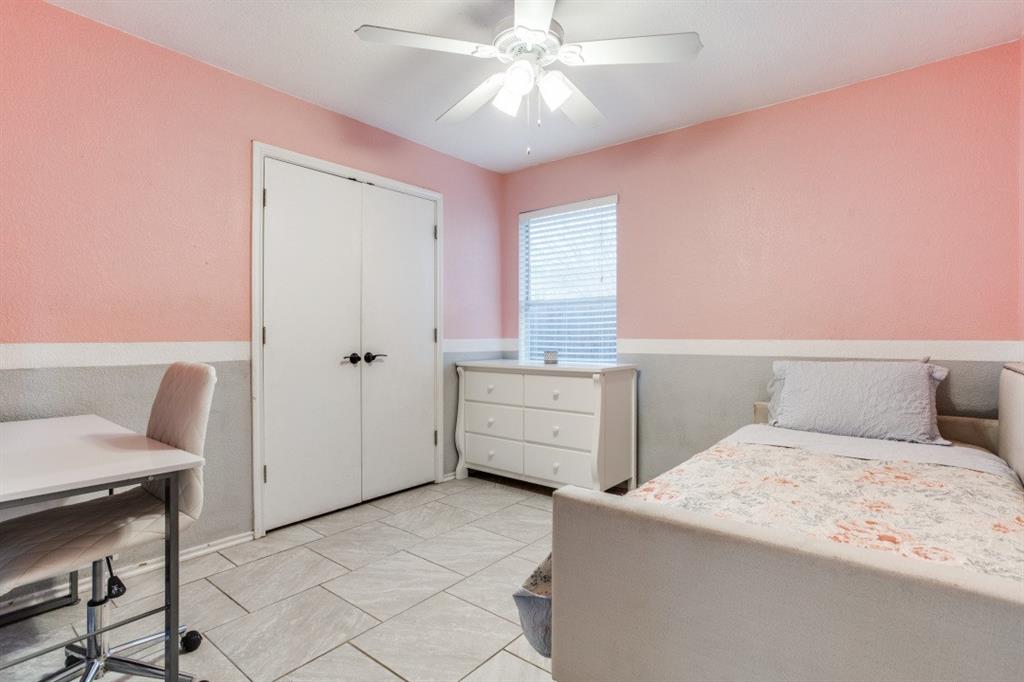 Undisclosed Address Austin, TX 78744 - Photo 10 of 18 a bedroom with a bed and furniture