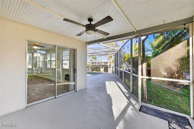 a view of a hallway with a ceiling fan