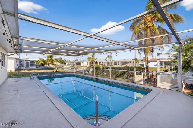 a view of a swimming pool with a lounge chair