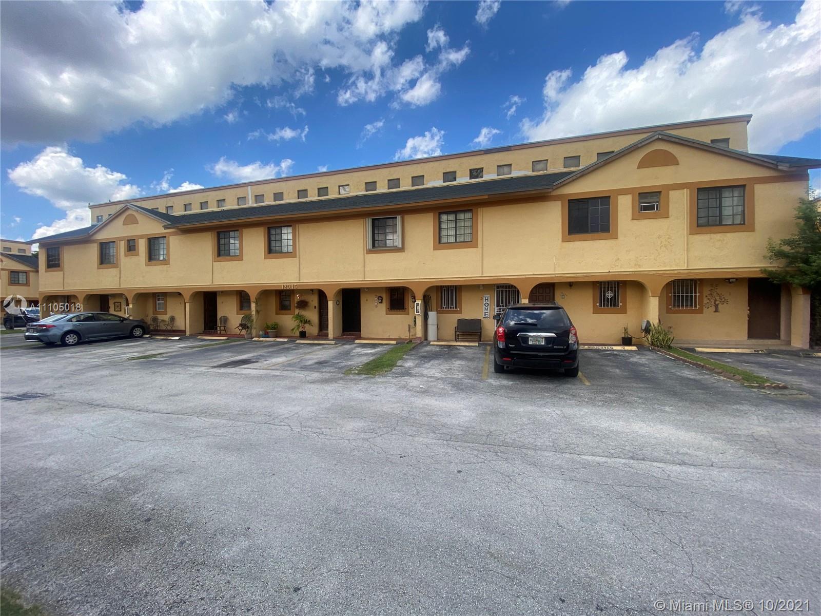 a view of a car park in front of a building