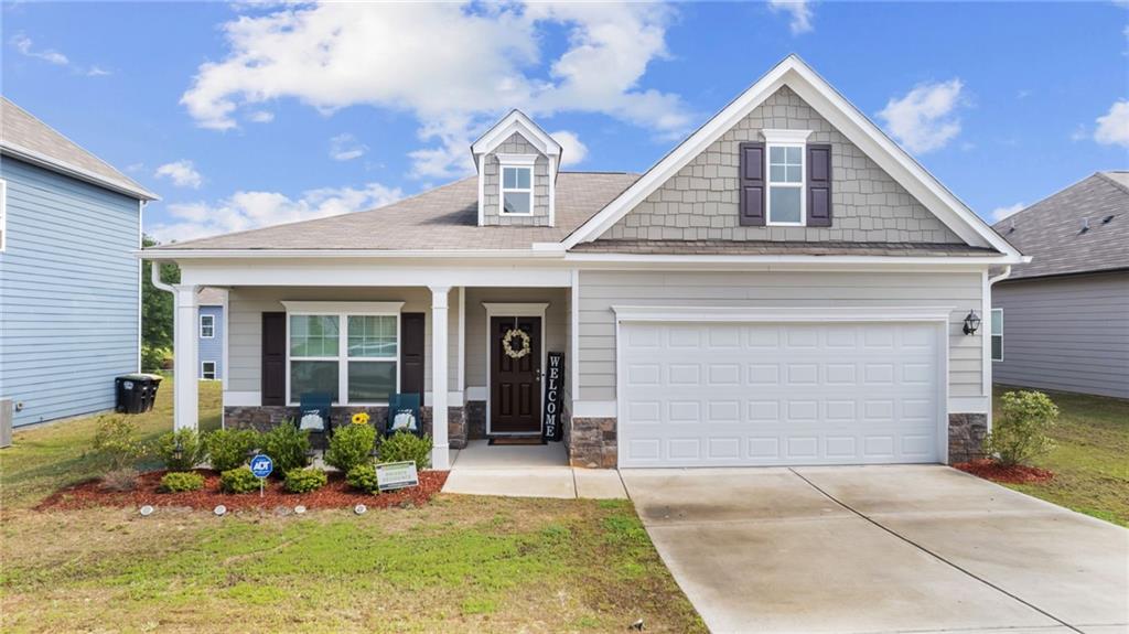 3 Joplin Street Northeast Rome, GA 30161 - Photo 1 of 26 a front view of a house with a yard and garage