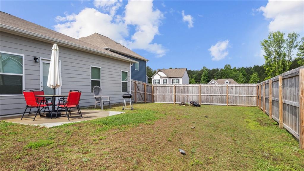 3 Joplin Street Northeast Rome, GA 30161 - Photo 23 of 26 a view of a backyard with a small cabin and furniture