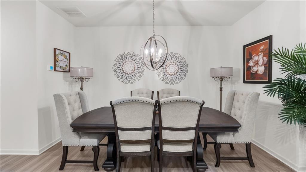 3 Joplin Street Northeast Rome, GA 30161 - Photo 6 of 26 a view of a dining room with furniture wooden floor and a chandelier