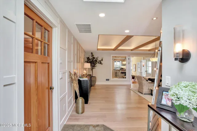 a living room with stainless steel appliances kitchen island granite countertop furniture and a view of kitchen