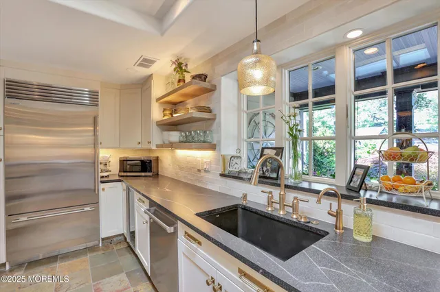 a bedroom with a bed and a fireplace