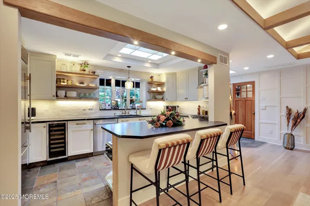 a bathroom with a sink and a large mirror