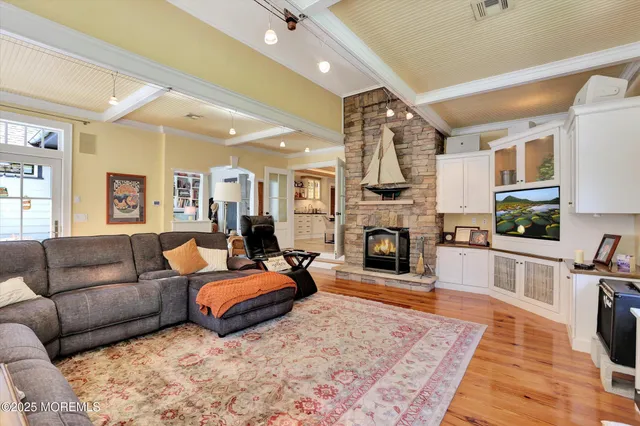 a view of a patio with table and chairs with wooden floor and fence