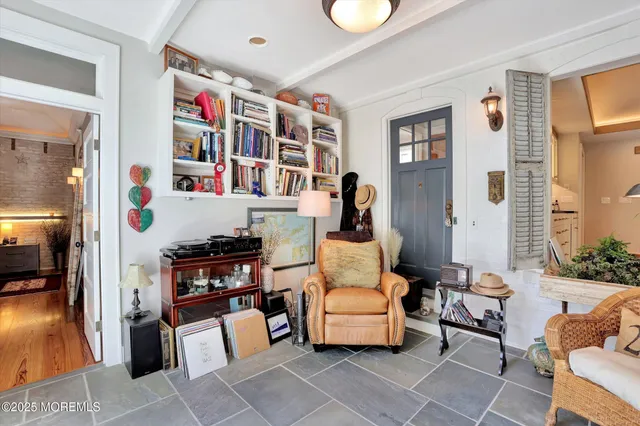 a view of a patio with couches table and chairs and potted plants