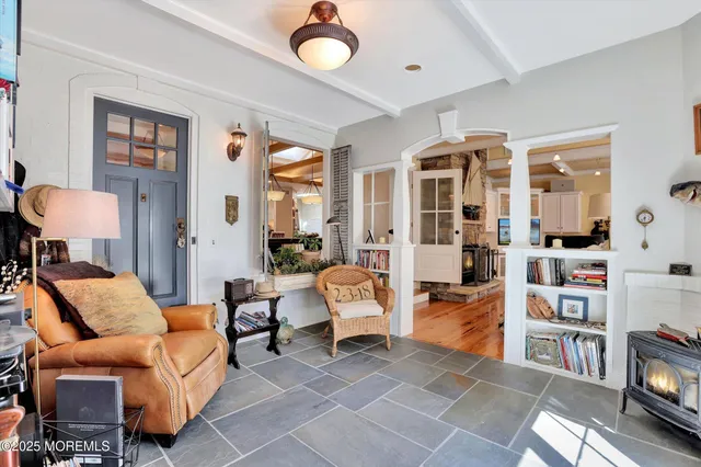 a view of a patio with table and chairs under an umbrella