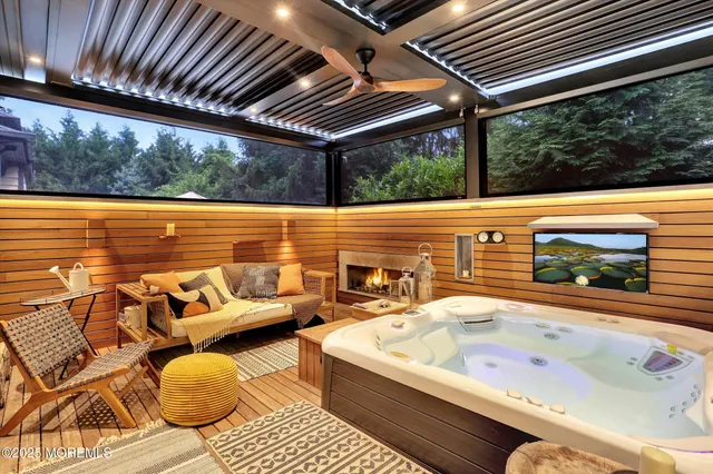 an aerial view of a house with yard swimming pool and outdoor seating