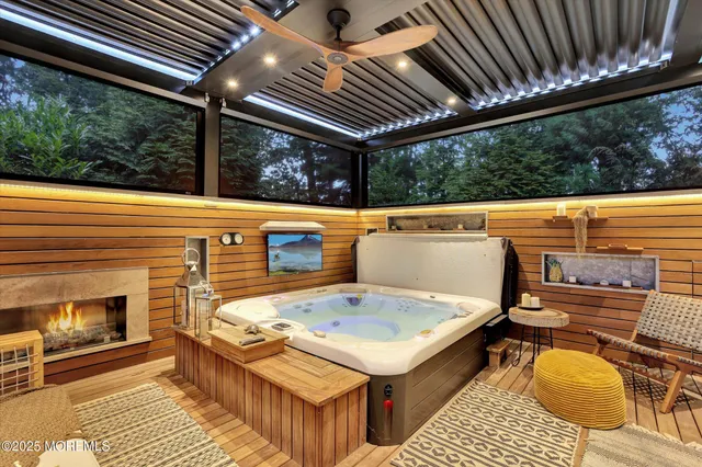 an aerial view of residential houses with outdoor space and trees all around