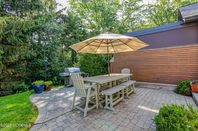 an aerial view of a city with lots of residential buildings and mountain view in back